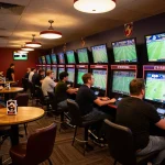 Betting excitement at Keonhacai5 sports lounge with fans placing wagers on live games.