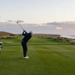 Golfing at cullengolfclub.co.uk during sunset, showcasing the scenic views.